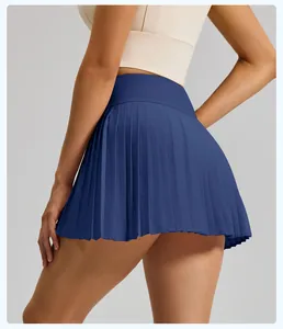 Back view of a blue high-waisted pleated sports skort for fitness and tennis activities