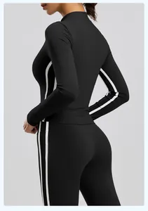 Back view of a slim-fit black long-sleeve yoga jacket with white side stripes.
