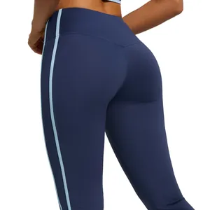 High waist navy yoga leggings with light blue side stripes and peach butt lifting