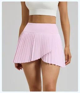 Pink pleated athletic tennis skirt with asymmetrical slit detail and slim fit design