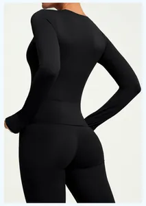 Back view of black long-sleeved slim-fit yoga top showing high-elasticity fabric material