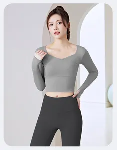 High-quality slim fit gray long-sleeve yoga top featuring thumbholes and V-neckline