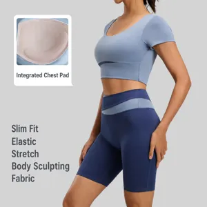Women's two-piece yoga set featuring short sleeve crop top and high-waisted biker shorts