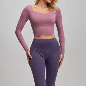 Breathable long sleeve yoga set with padded crop top and high waist leggings for fitness
