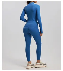 Back view of blue ribbed yoga set featuring long sleeve top and matching leggings