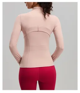 Detailed back view of pink slim fit yoga jacket showing unique curved stitching patterns