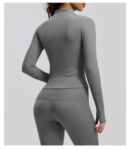 Back view of grey slim fit yoga jacket with ribbed sleeve detail and matching leggings