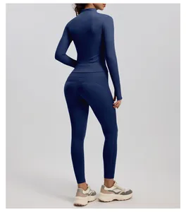 Back view detail of navy blue ribbed yoga set featuring long sleeve zip top and leggings