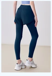 Back view of dark teal fake two-piece yoga leggings with high waist for fitness workout