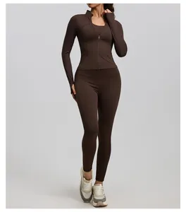Full view of model wearing a brown ribbed yoga set with a stand-up collar jacket.