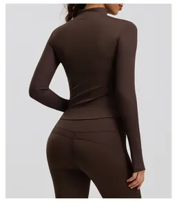 Detailed back view of a dark brown long-sleeved athletic top and matching yoga leggings set