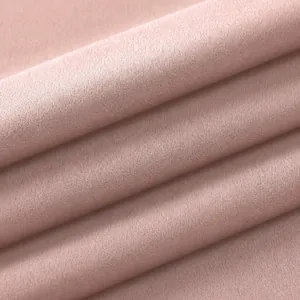 Macro detail of soft pink high-elastic nylon spandex fabric texture for yoga wear