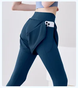Close-up of side pocket on high-waist fake two-piece yoga leggings containing a phone