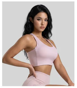 Close-up detail of a high-elastic pink yoga sports bra featuring fixed cups on a female model