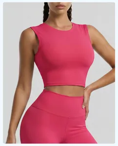Vibrant pink women's cropped sports tank top and high-waisted yoga leggings set