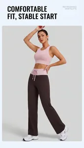 Detail view of high waist yoga pants with pink drawstring and brown wide leg design