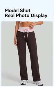 Detail view of high-waisted contrast drawstring straight-leg sports pants for yoga