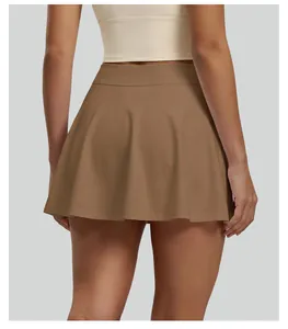 Back view of a high-waisted pleated tennis skirt in brown for sports and yoga
