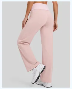 Close-up of pink high-waisted straight leg yoga pants for women, elastic sports trousers