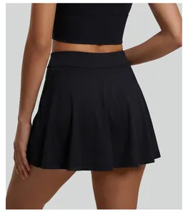 Detailed back view of a high-waisted pleated black tennis skirt with athletic fabric texture