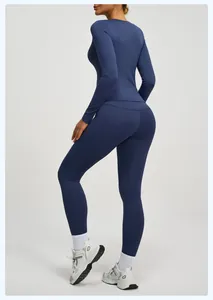 Set da yoga blu scuro da donna con top a maniche lunghe e leggings push-up per il fitness