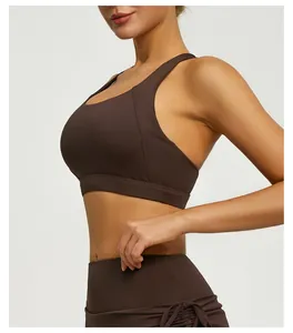 Close-up detail view of professional dark brown high-elastic yoga sports bra on model