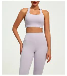 Front view of professional light purple yoga set featuring cross back sports bra and leggings