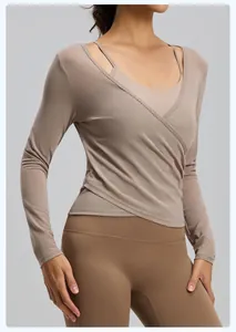 Detail view of breathable mesh wrap yoga two-piece set with long sleeve cover-up