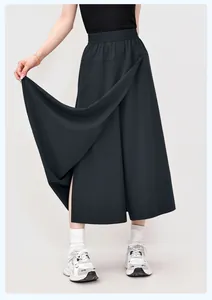 Detailed view of black loose Yamamoto-style wide-leg culottes with elastic high waist.
