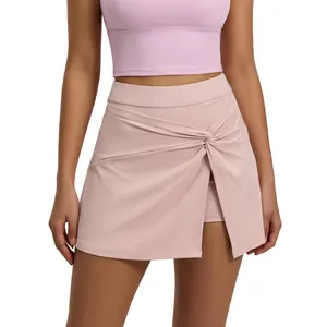 High waist pink tennis skort with a stylish front twist knot and built-in shorts