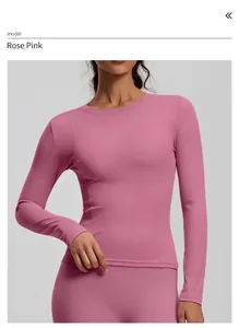 Detail of dusty rose long sleeve yoga top with crew neck and slim fit design