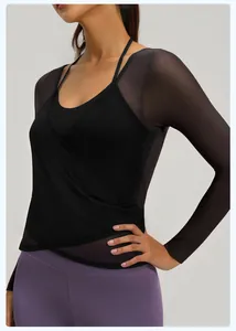Detailed view of black mesh long-sleeve yoga top with layered wrap design