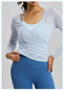 Close-up detail of breathable light blue mesh long sleeve yoga cover-up top for women