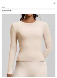 Front detail of a slim-fit ivory long-sleeved yoga top on a model