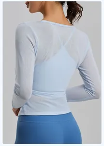 Detail view of breathable light blue mesh long sleeve yoga cover-up top for women