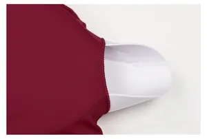 Close-up detail of removable padding and soft fabric of a burgundy yoga sports bra.