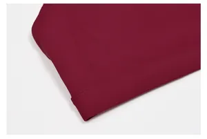 Close-up of maroon yoga bra showing professional stitching and smooth elastic fabric texture