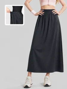 High-waisted black A-line athletic skirt pants featuring an elastic stretch design