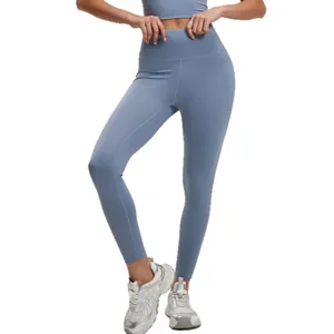 High waisted light blue yoga leggings with peach lift effect for fitness and gym.