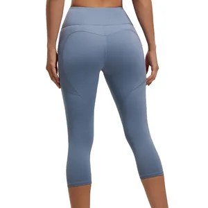 Leggings yoga capri a vita alta con tasche laterali ed effetto push-up in blu opaco