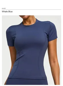 Detail of a slim-fit navy blue yoga short sleeve top featuring athletic flatlock seams