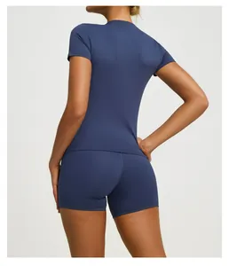 Detailed back view of a navy blue short sleeve yoga top and matching athletic shorts set