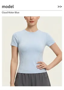 Detailed view of a slim-fit light blue short sleeve yoga workout top on a female model
