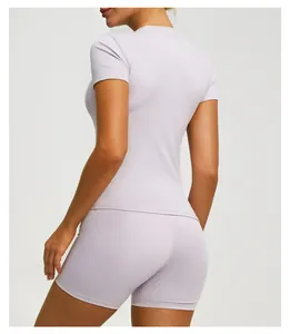 Back view of lavender short sleeve yoga top and matching cycling shorts for fitness training
