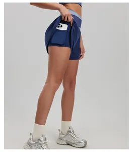 Detail view of high-waist yoga shorts with built-in pocket for phone