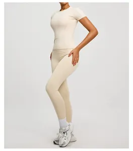 Slim fit beige yoga set featuring a short sleeve top and high waisted sport leggings