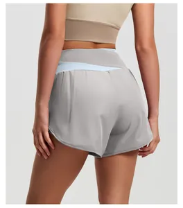 Detail back view of high-waisted color-block yoga shorts for gym and summer workouts.