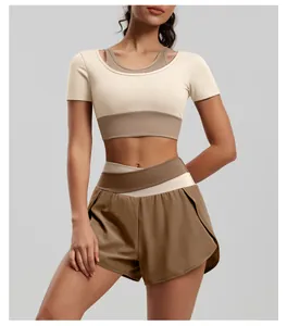 Detail of two-tone high-waist yoga shorts and matching fitness crop top set