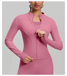 Close-up of slim-fit pink yoga jacket with high neck zipper and athletic mesh detail