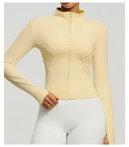 Close-up view of a slim-fit pale yellow yoga jacket with a full zipper and stand collar